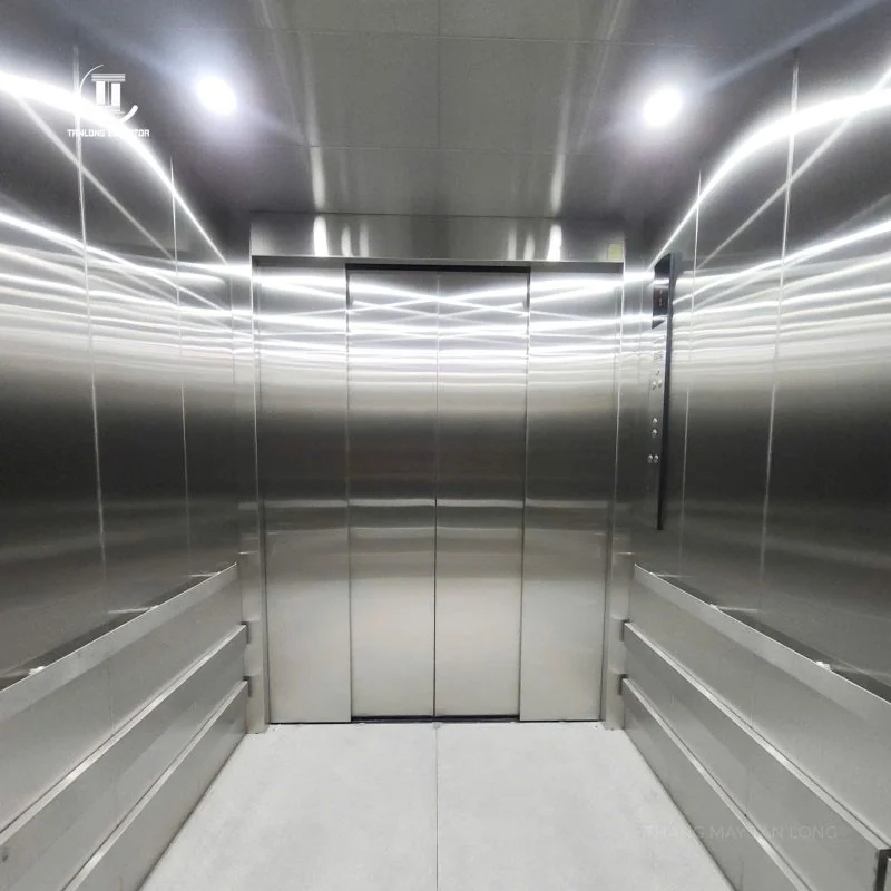 Metal ceiling and lights inside a Tan Long freight lift cabin at the Hanoi textile factory project